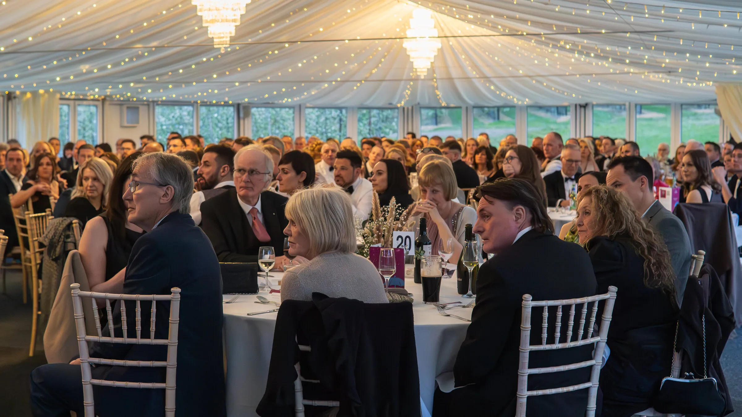 Guests at a corporate event in the marquee at The BarnYard