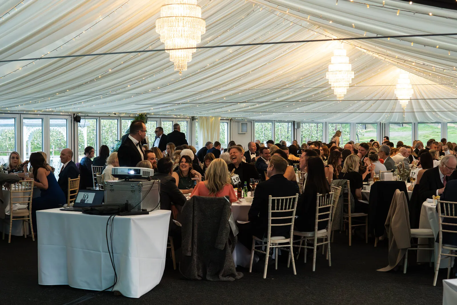 A black-tie corporate dinner in the marquee at The BarnYard