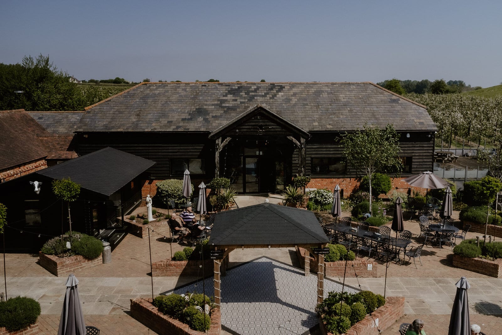 A peaceful aerial view over The BarnYard and its orchards