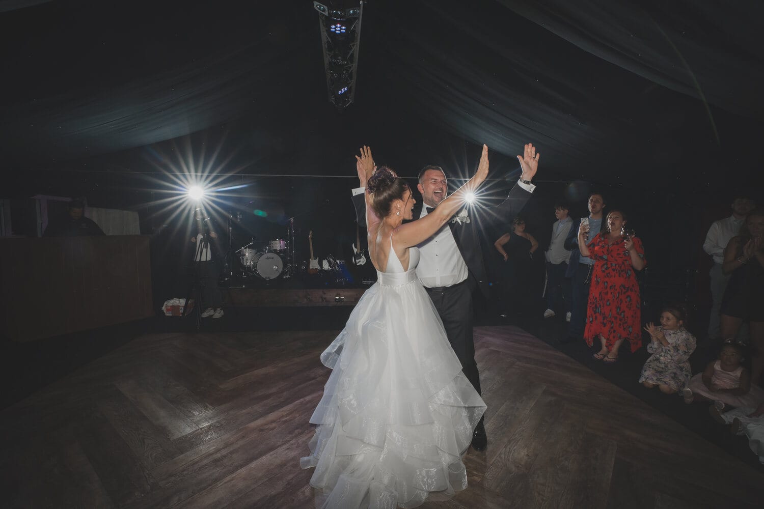 A first dance beneath the fairy-lit ceiling