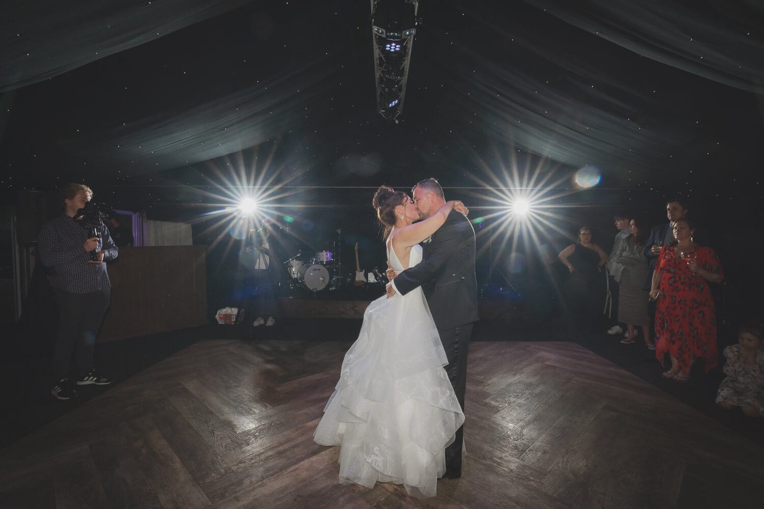 A couple dancing in the candlelit Arboretum