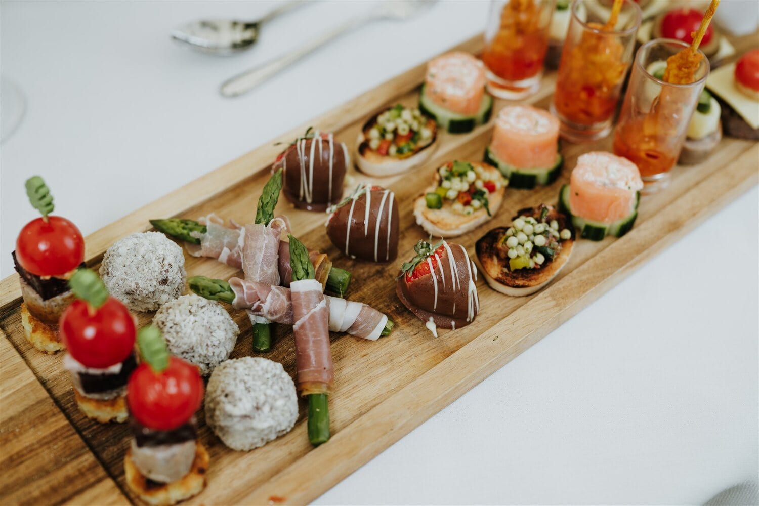 A long board of canapés in the Arboretum