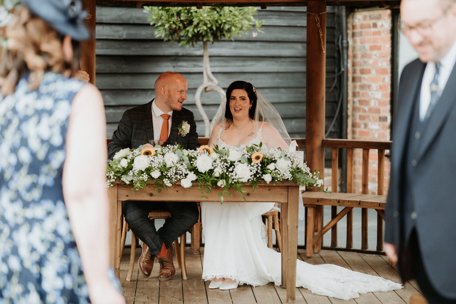 Signing the register at a courtyard ceremony