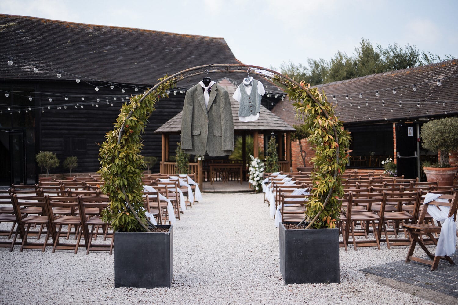The courtyard and barns strung with fairy lights in the evening