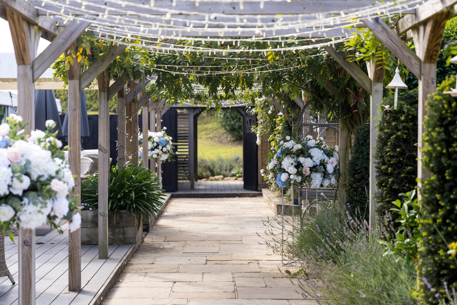 The green pergola walkway lined with greenery on the lavender walk