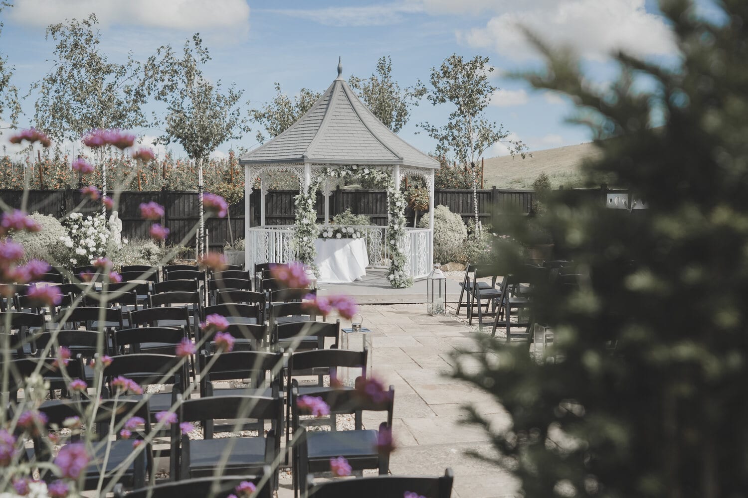 Rows of chairs set for a ceremony at the lavender walk gazebo