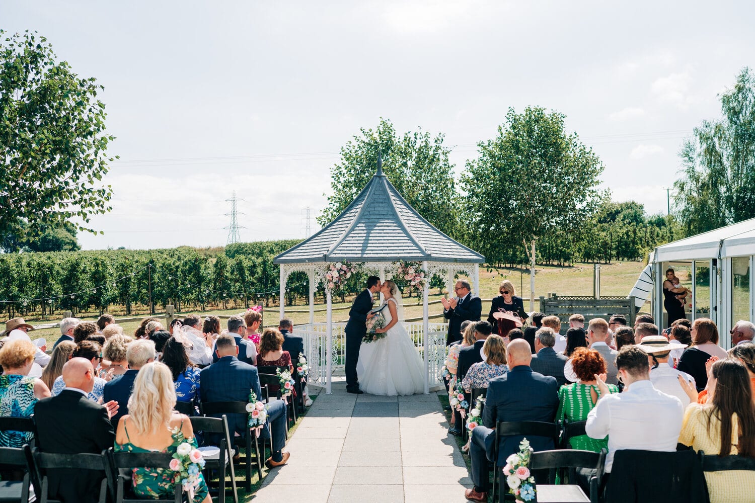 An Orchard Garden ceremony underway with guests seated