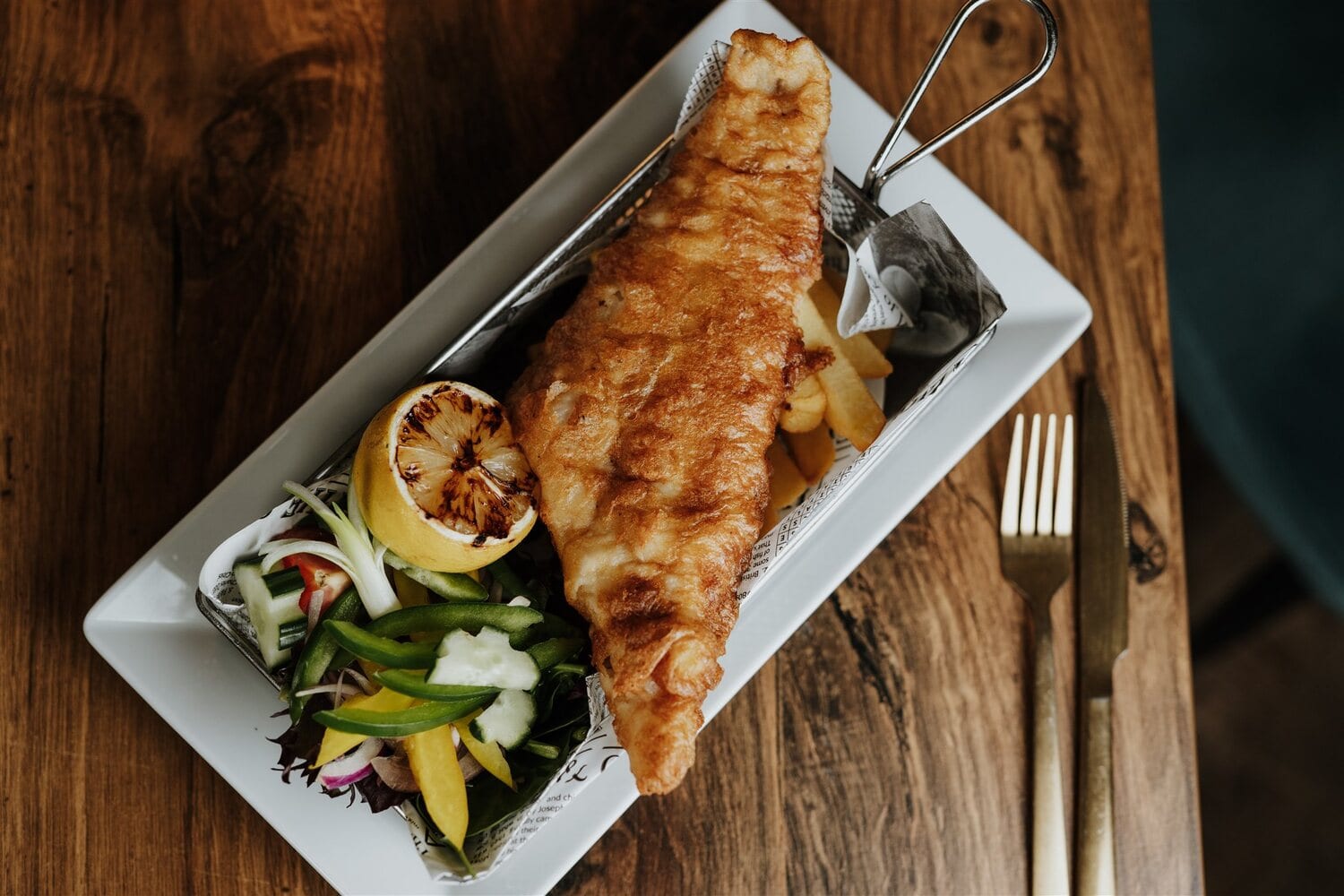 Pan-fried fish with seasonal vegetables and lemon