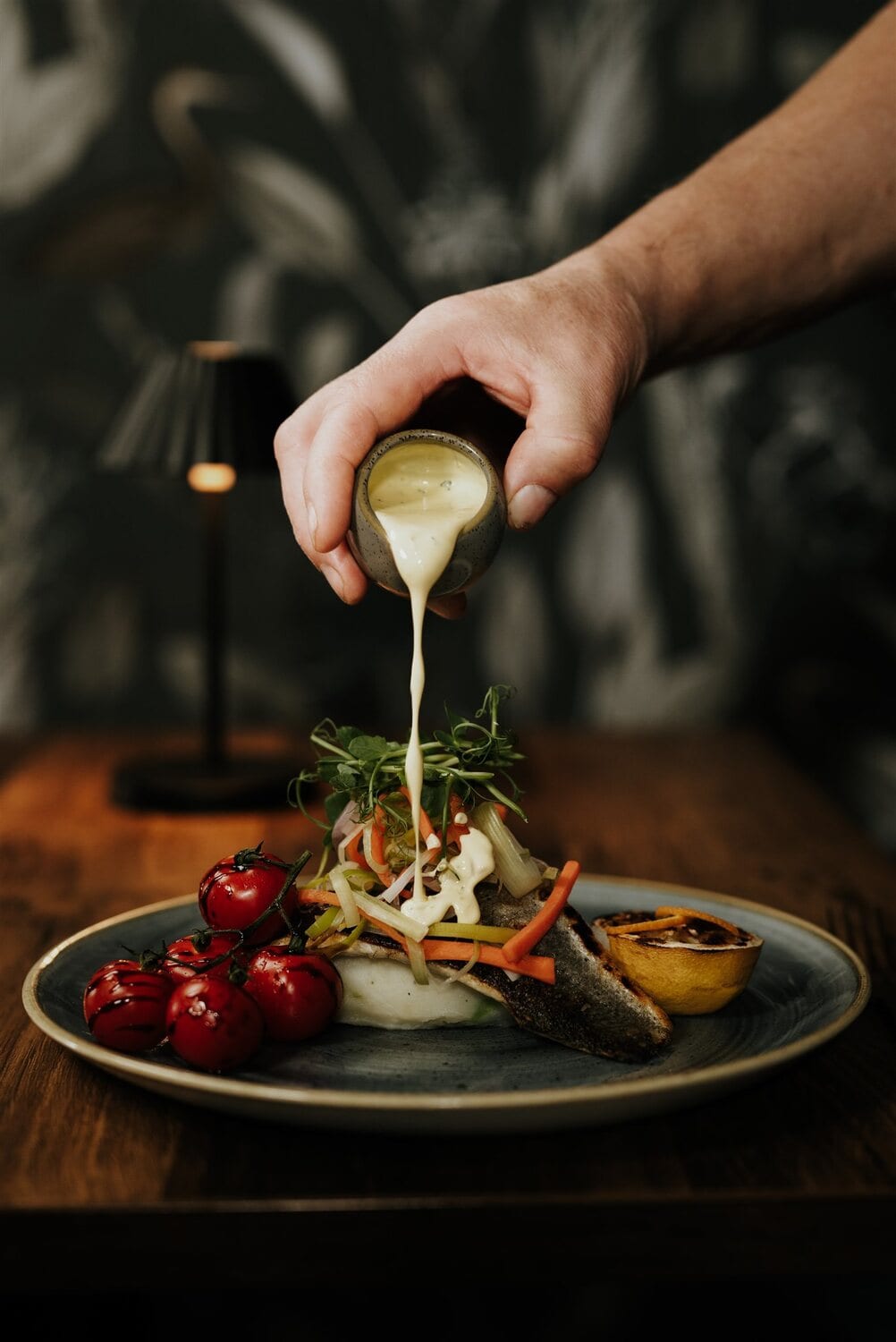 A refined plated dish with fresh garnish