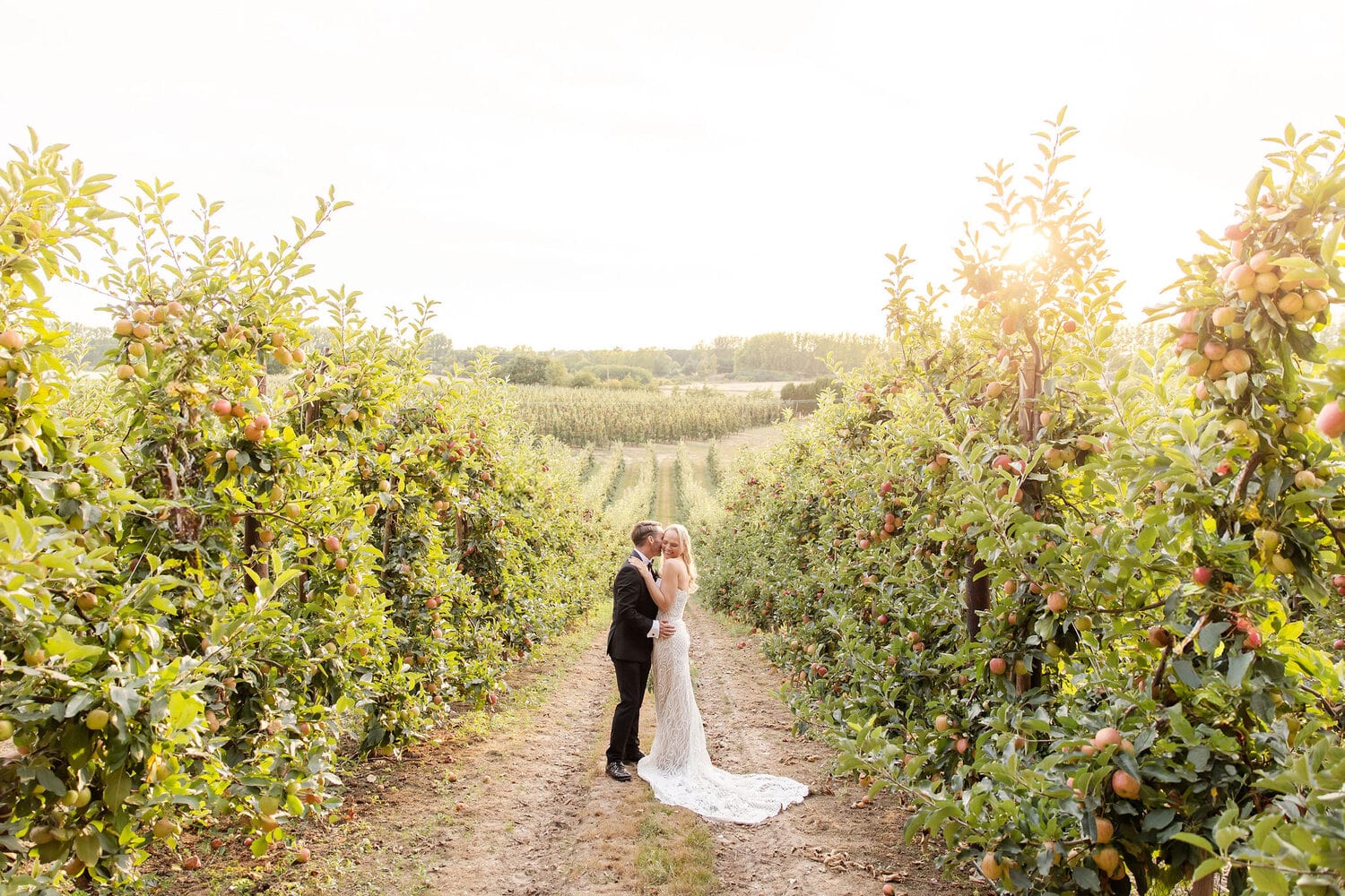 Newlyweds in the orchard at The BarnYard