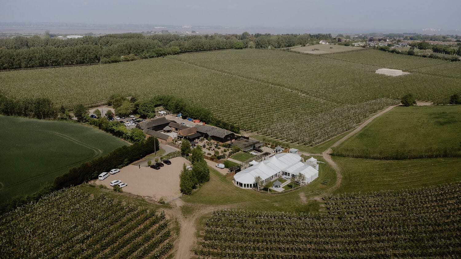 An aerial view across the fields and orchards