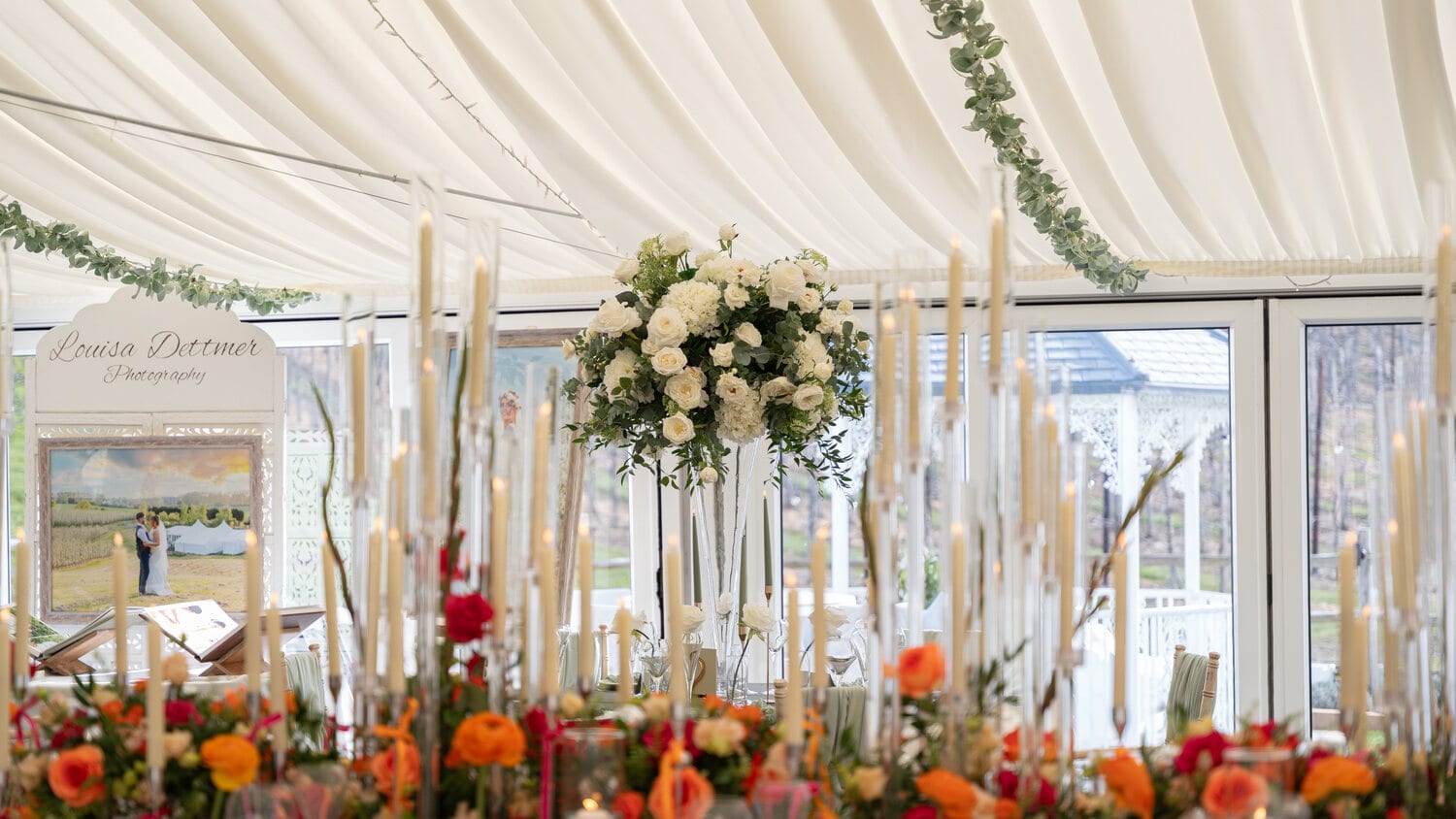 Tables laid in the marquee for the wedding breakfast