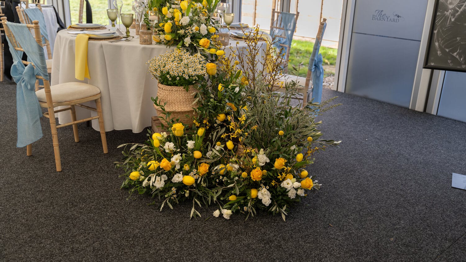 A greenery centrepiece on a wedding table