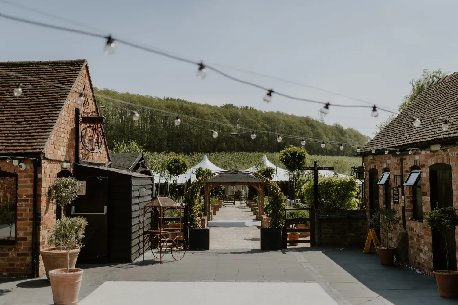 The festoon-lit courtyard entrance at The BarnYard in Kent