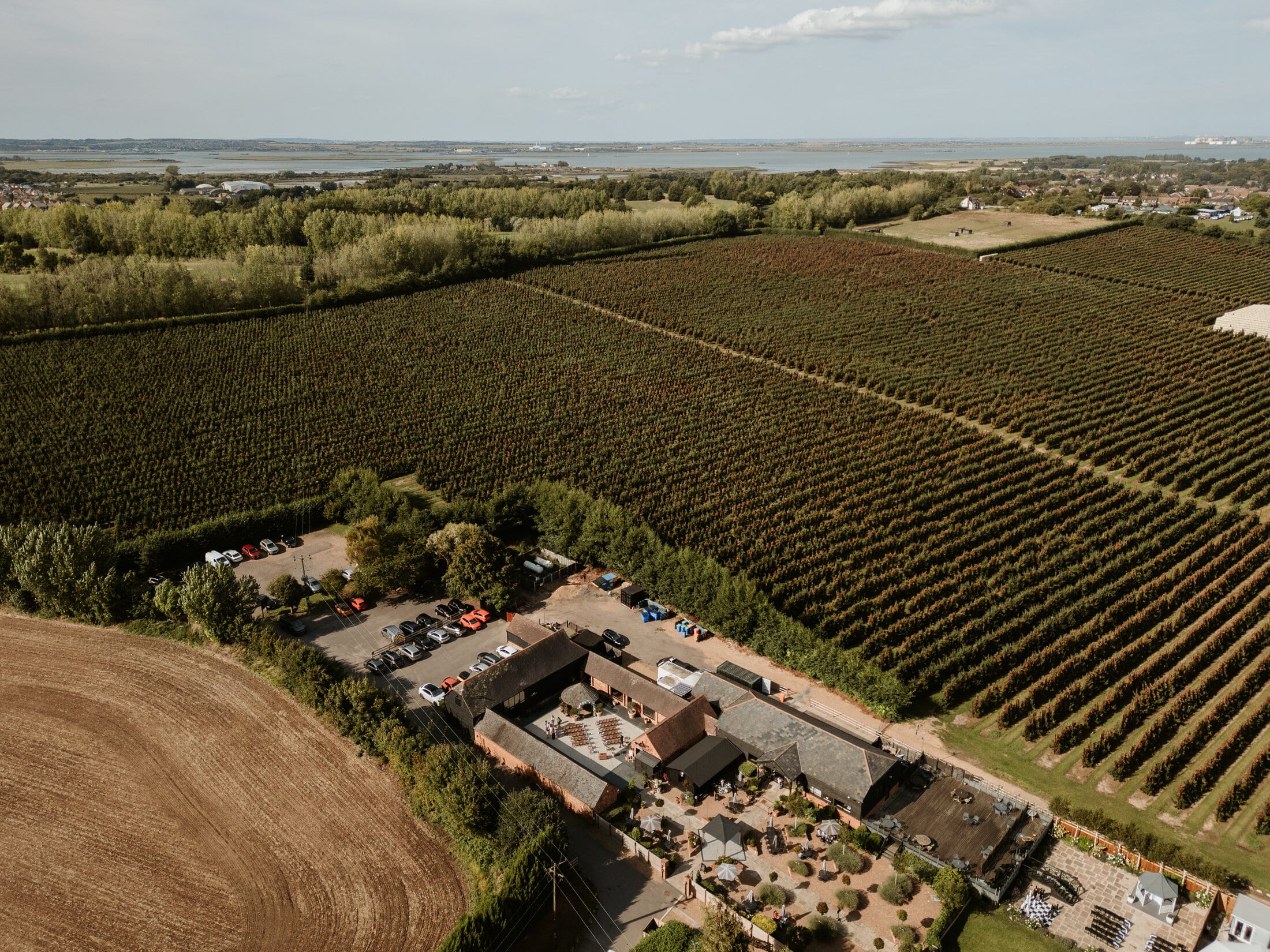 An aerial view of The BarnYard and its orchards in the Kent countryside