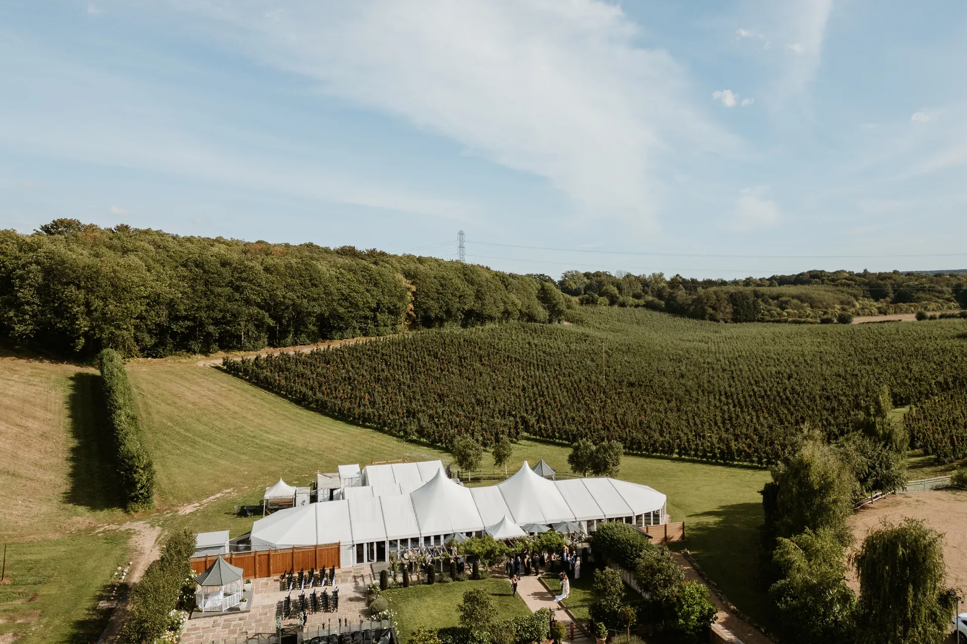 Aerial view of a bride in the apple orchards at The BarnYard